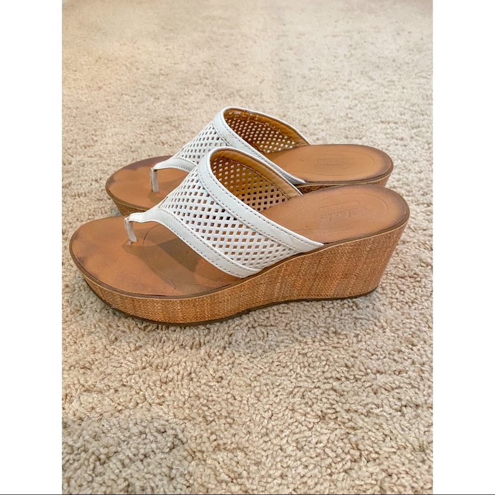 Clark’s Collection white sandals.